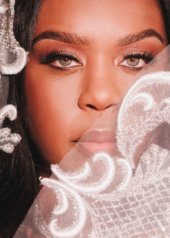 Ashley Turner, Daughter of Houston Mayor Turner, wears a veil and bridal makeup for her bridal session at the laura hotel in downtown houston.