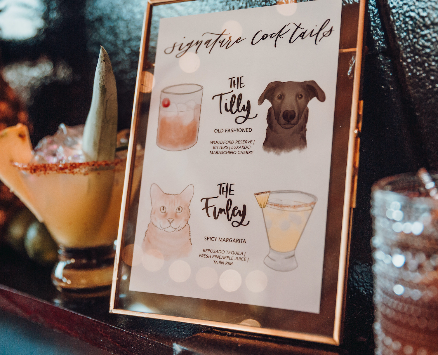 A cocktail menu that has drinks inspired by the couple’s dog and cat.