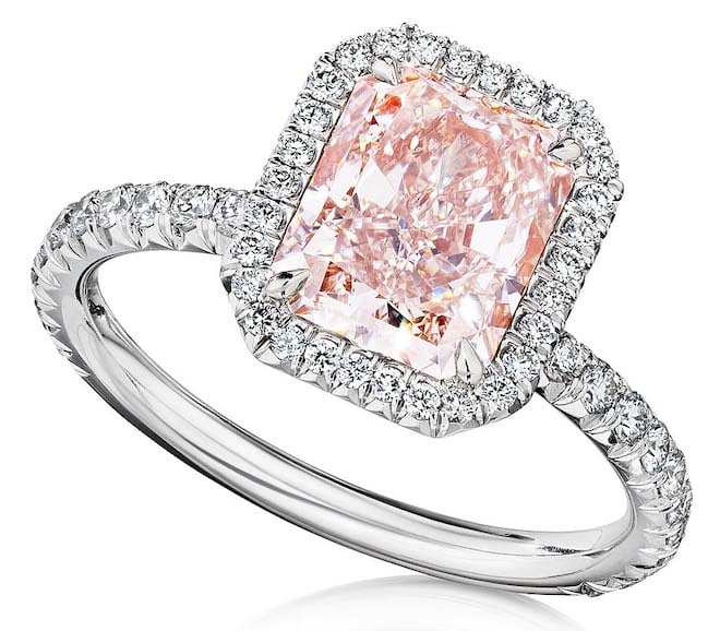 Zadok Jewelers sparkly 18k white gold diamond engagement ring with a pink diamond in the center