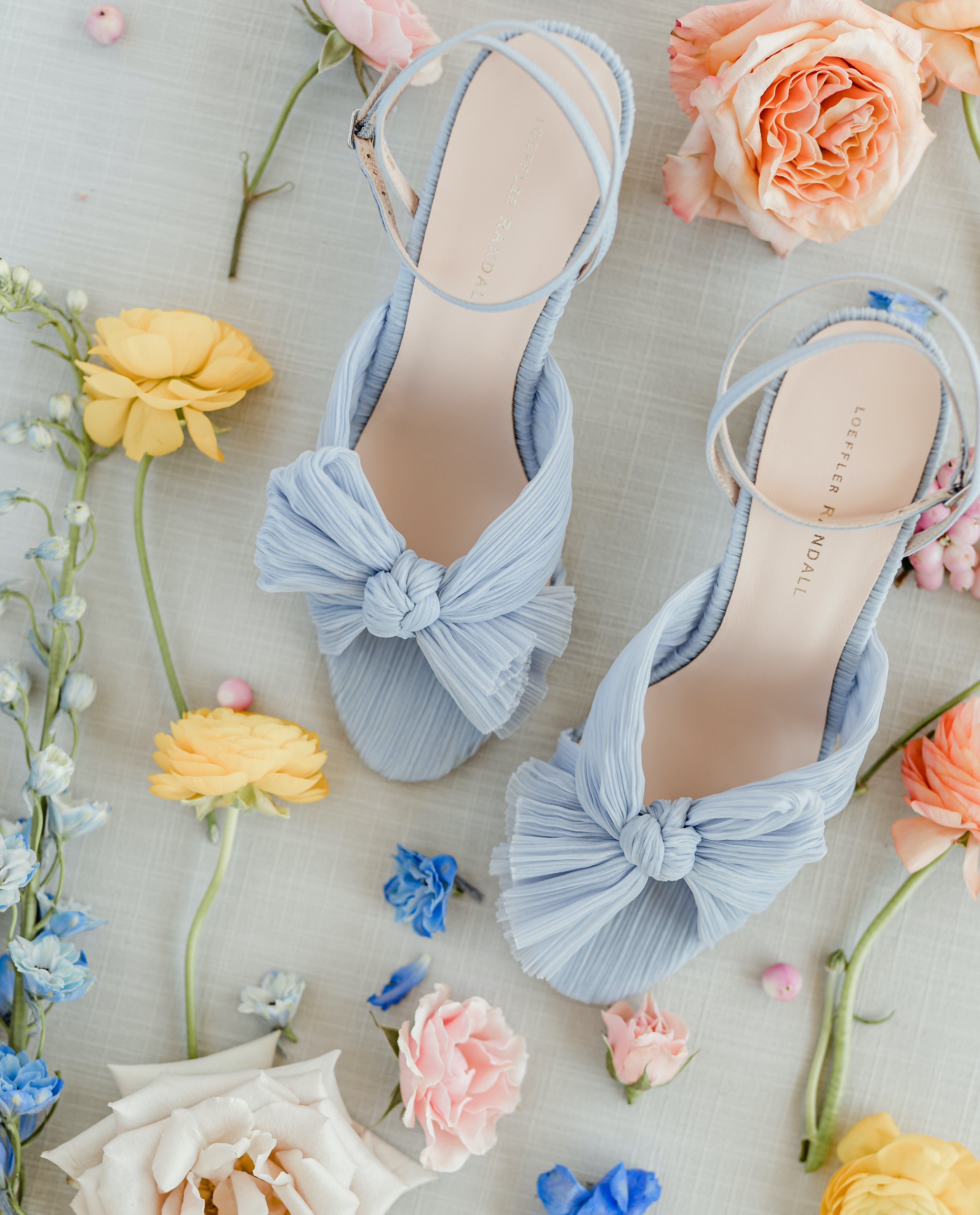 Pair of blue Loeffler Randall statement heels surrounded by fresh florals photographed by Houston photographer Amy Maddox Photography