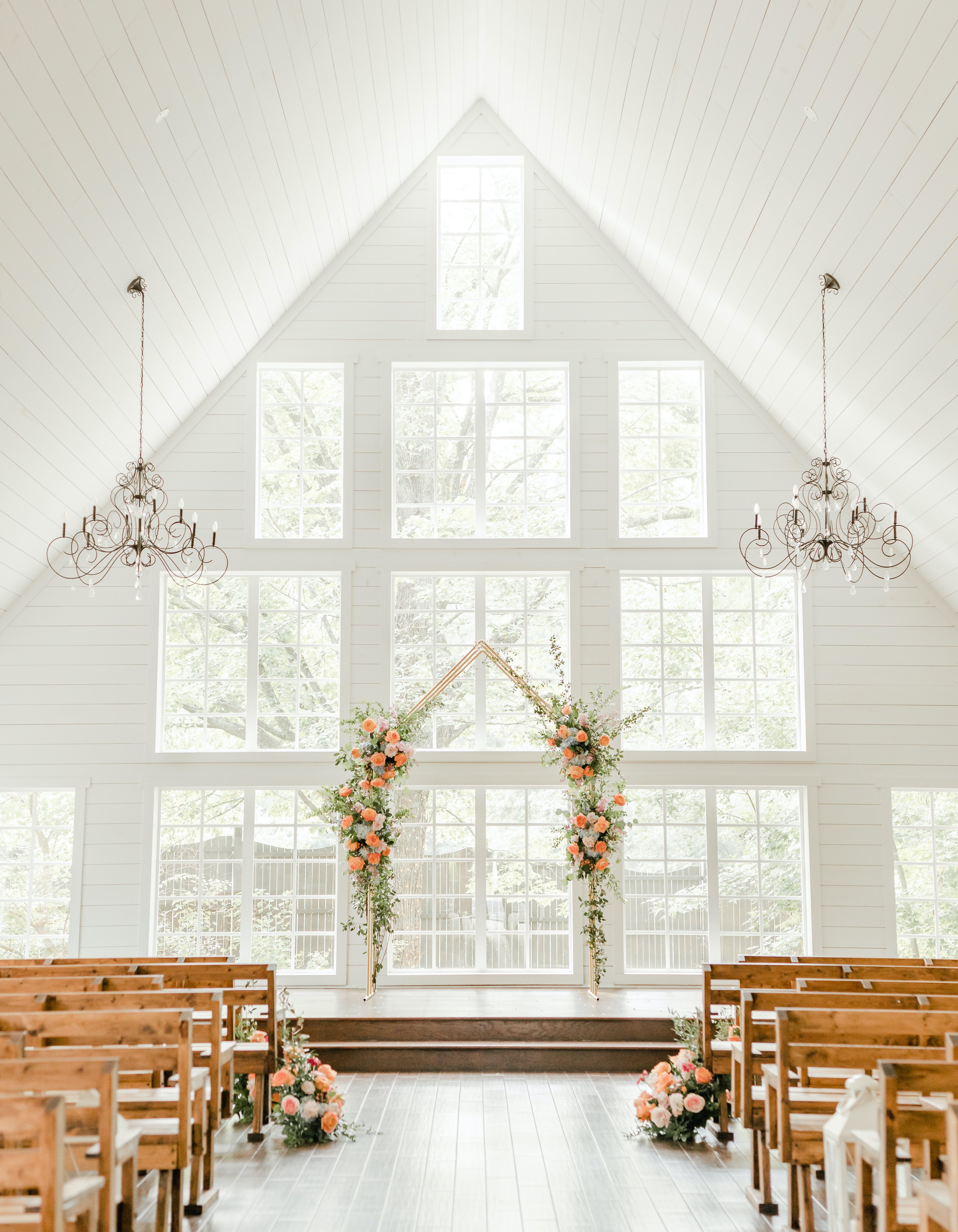 The Carriage House has a bright white chapel full of natural light and large windows. 