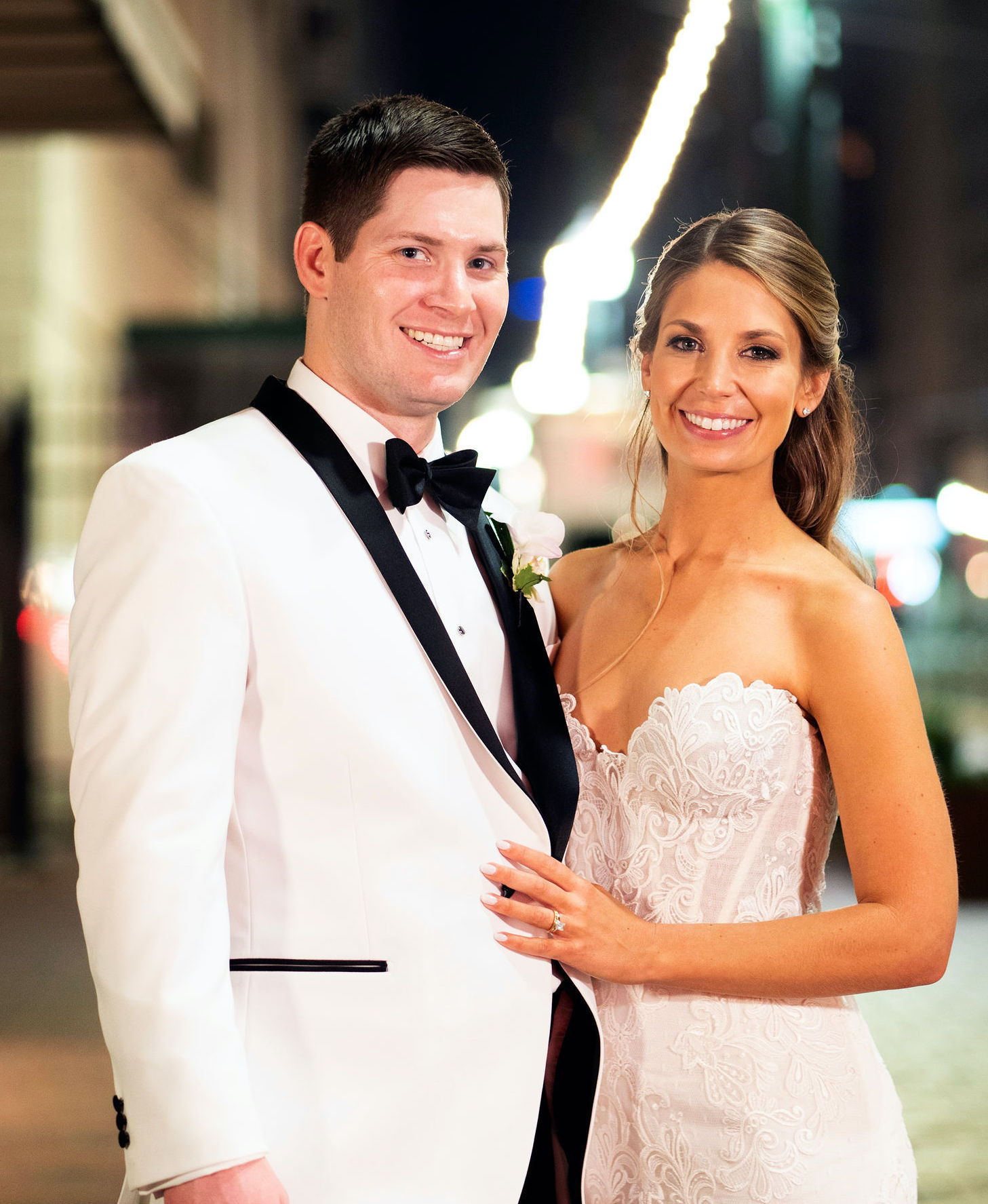 Groom and bride pose outside of houston wedding venue, The Corinthian Houston. 