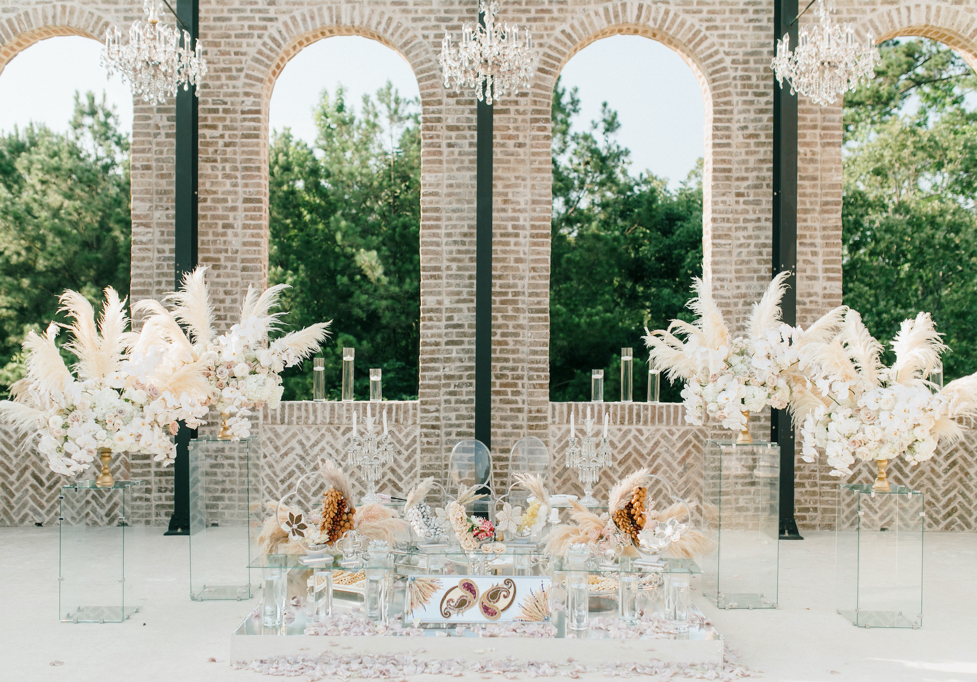 A Persian wedding ceremony is set up outside at the wedding venue Iron Manor in Montgomery, TX.