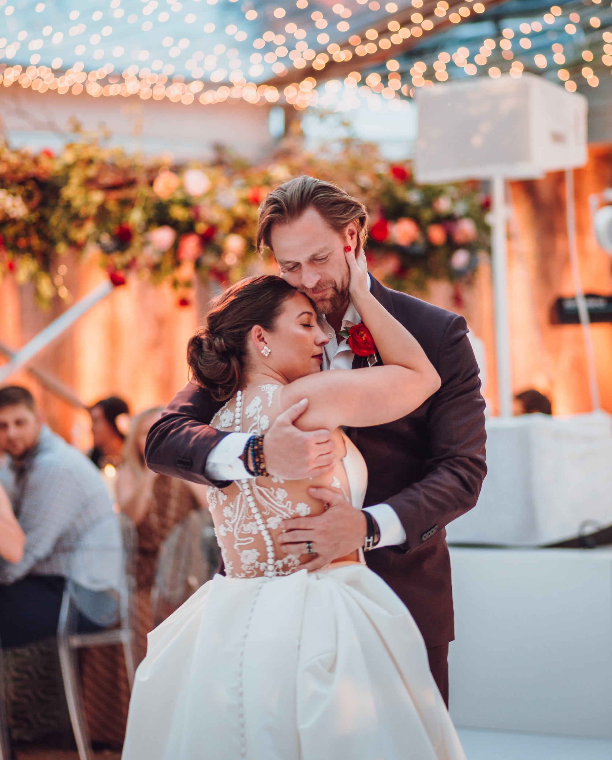 A bride and groom dance together at their wedding in Houston, TX.