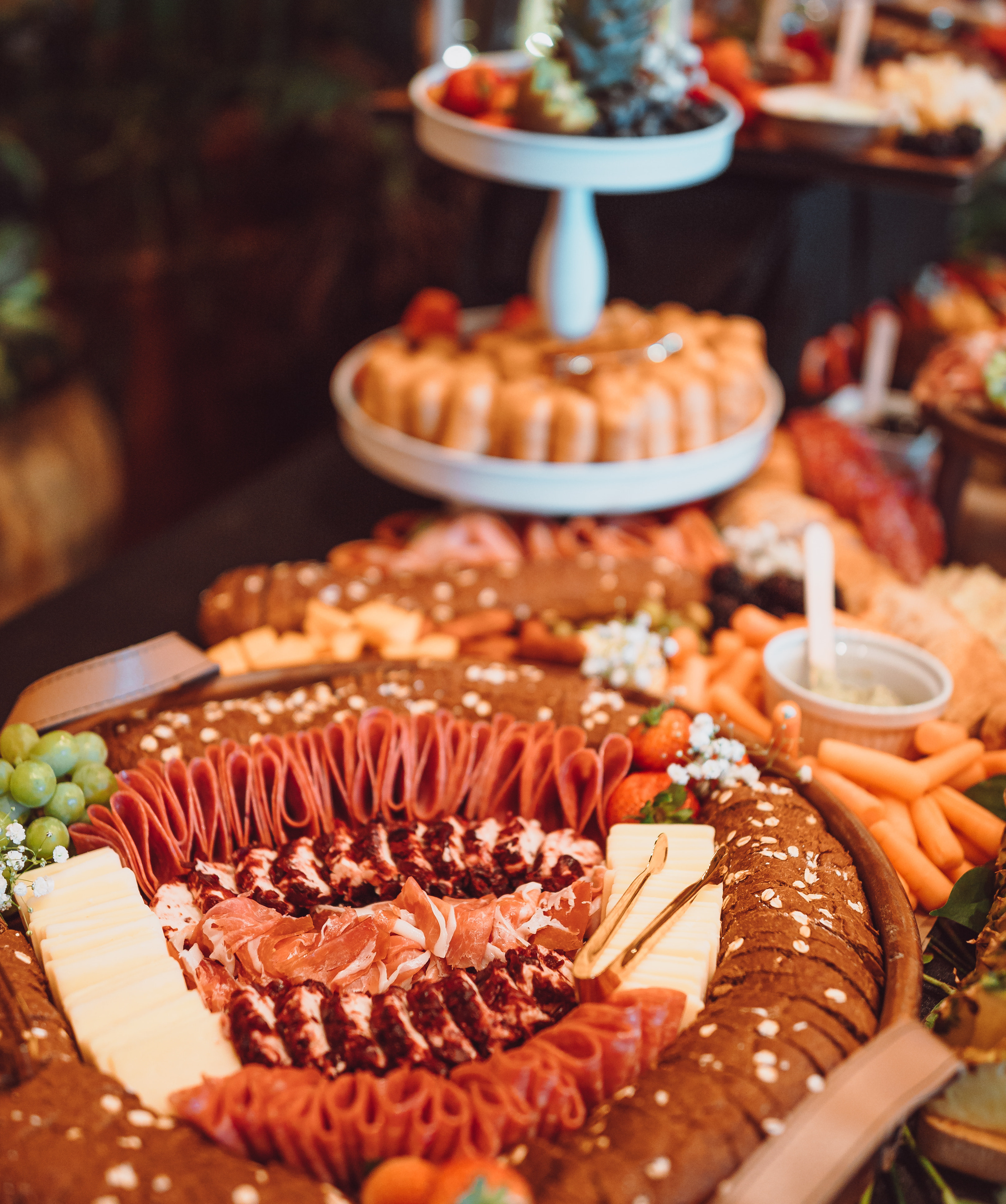 A charcuterie board is set up at a cocktail hour before a wedding reception at Agave Estates.