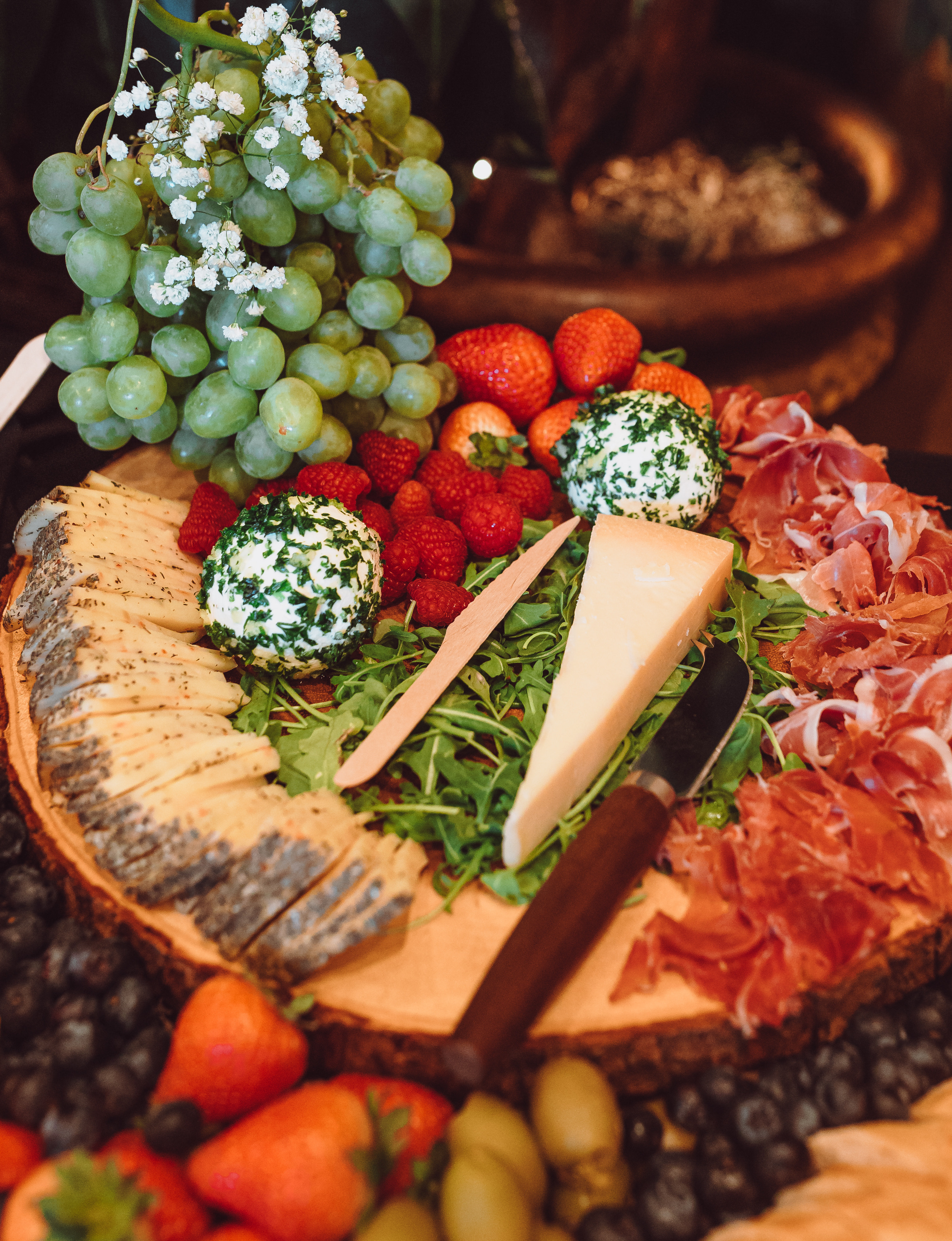 A meat and cheese platter is set up for a cocktail hour at a wedding in Houston, TX.