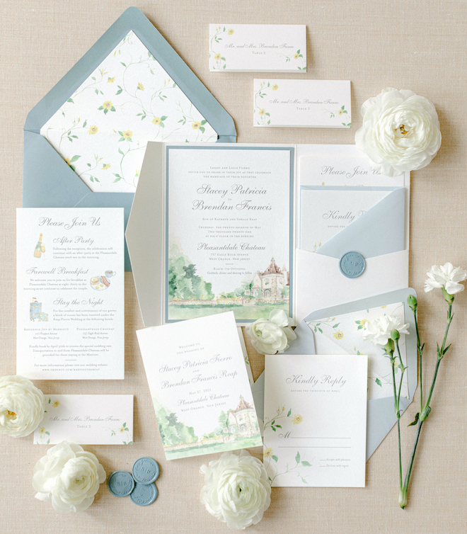 Yellow, white and blue invitation suite with custom illustrations, blue wax deals and floral print envelope liners by Crane & Palette. 
