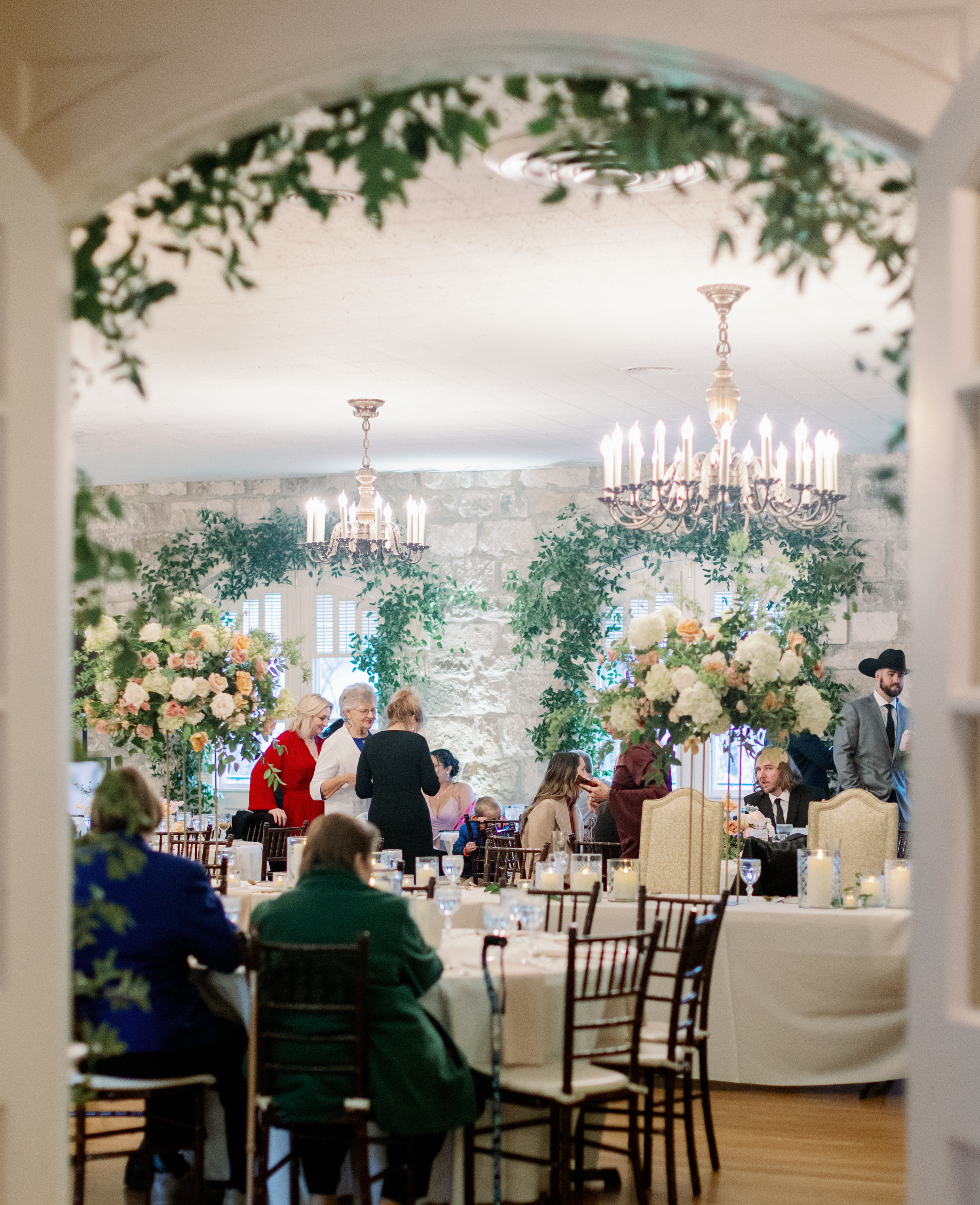 Guests start filling the wedding reception room for an early spring romance wedding in Austin, TX.