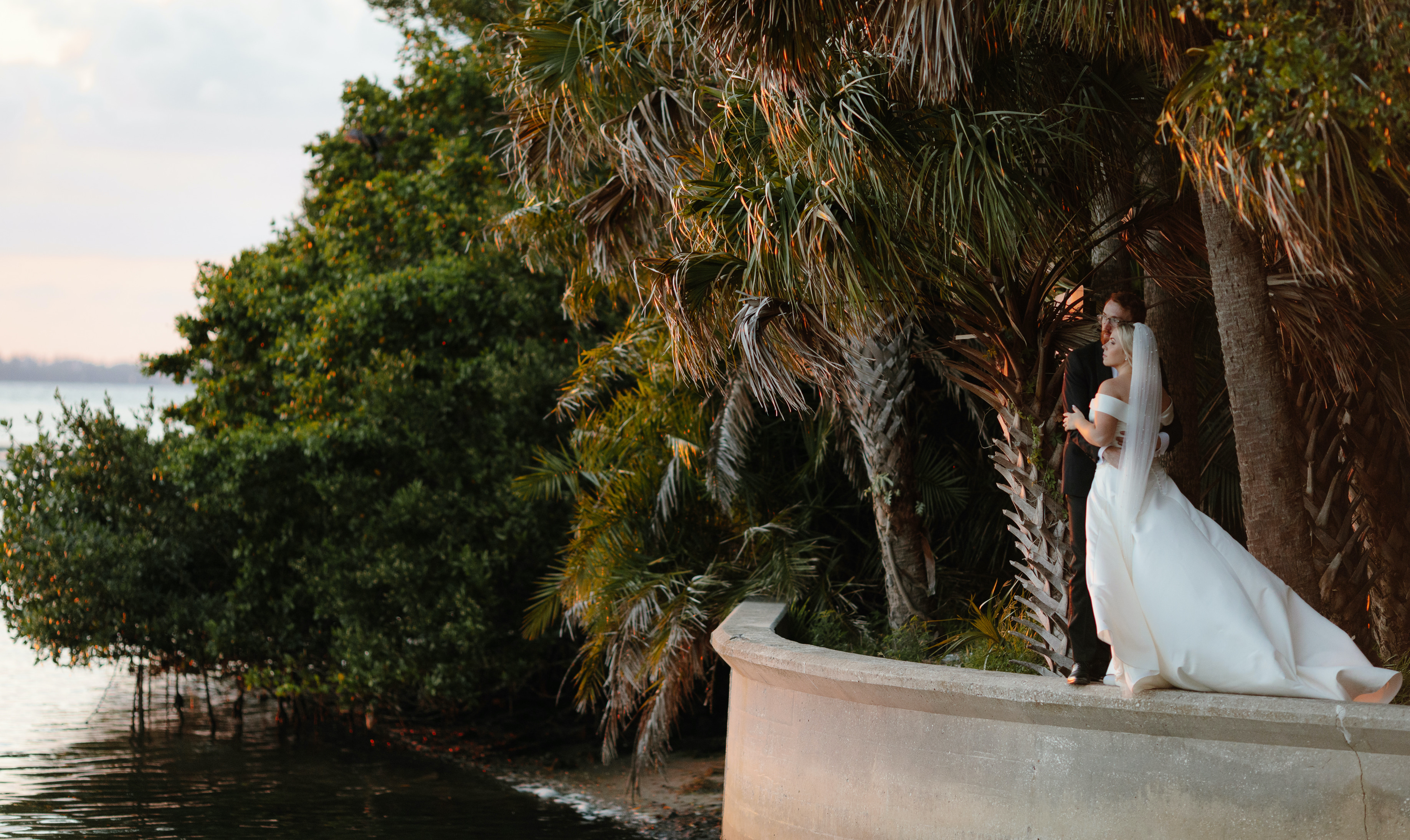 A bride and groom hold each other at their destination wedding in Sarasota Florida. 