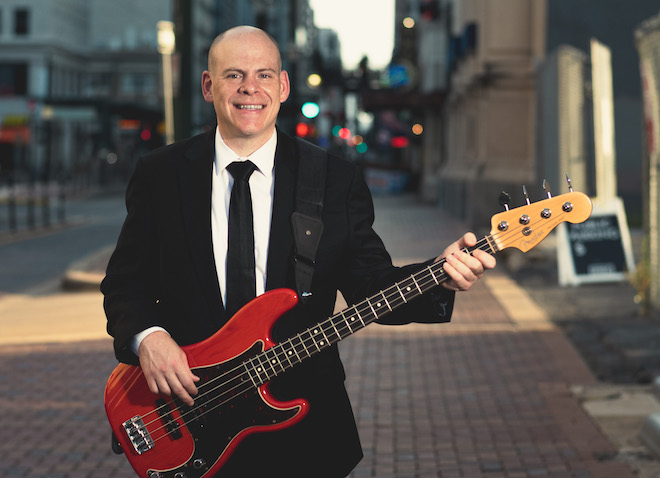 The bassist and founder of the live music and entertainment band, The Moment in Houston, Texas.
