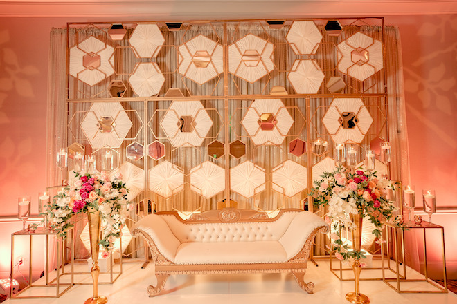 Geometric mirrored backdrop at the wedding reception.