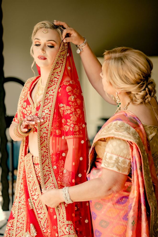 Mother of the Bride helping her daughter get ready for the ceremony