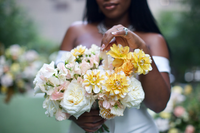 Bride holding a bouquet of flowers for the modern minimalist wedding editorial.