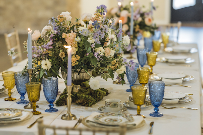 Peach, white and lilac floral centerpiece designed and created by Bloom and Grove.