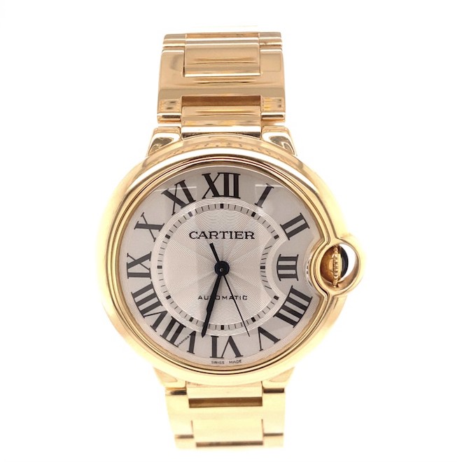Classy 18K yellow gold Cartier watch with a timeless black and white face.