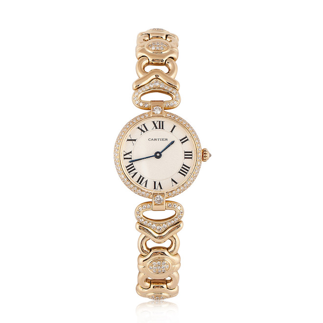 Gold and Diamond watch with a white dial with roman numerals and blue hands.