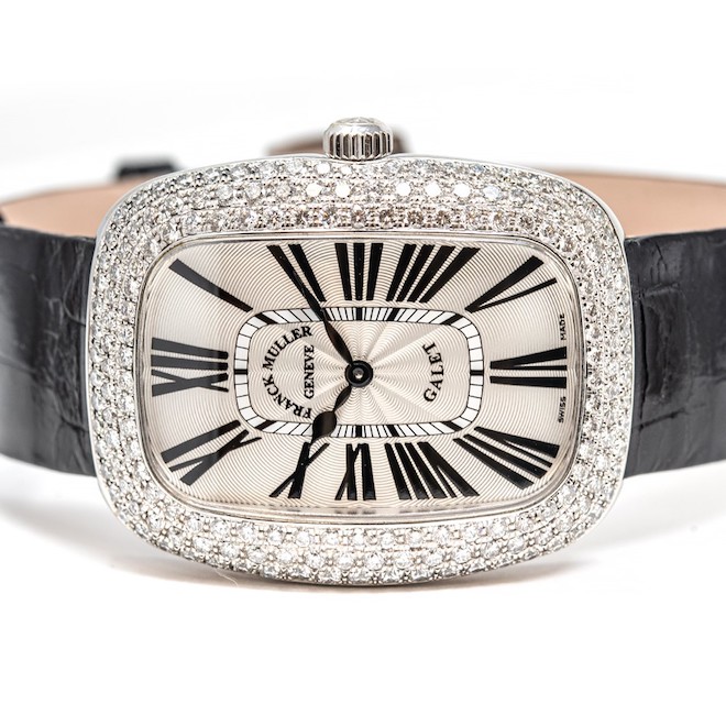 Frank Muller Galet Watch from I W Marls, a black band with diamonds surrounding the watch face.