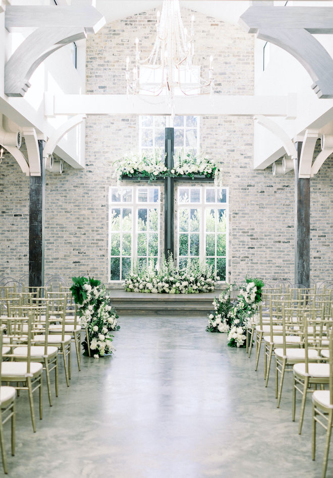 The chapel decorated with white florals before the ceremony.