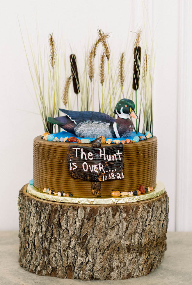 A dove hunting themed grooms cake reading "The Hunt is Over... 11/13/21"