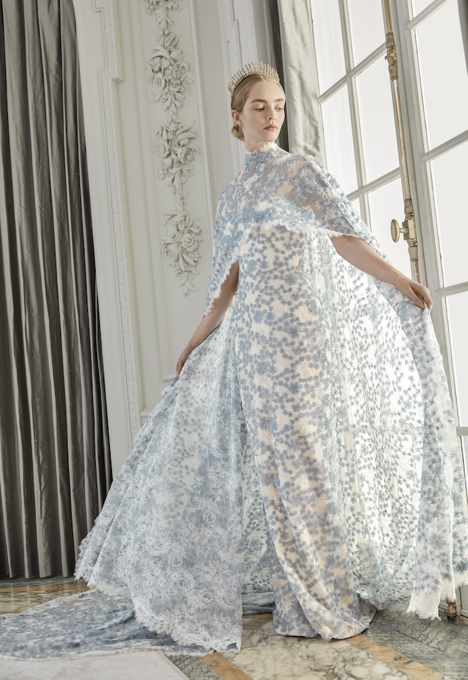A model posing in a blue and white bridal gown from Sareh Nouri's fall collection.