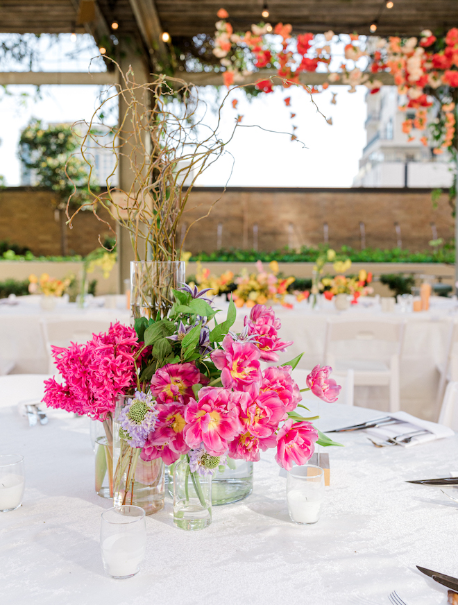 Pink floral arrangement decorating the reception table. 