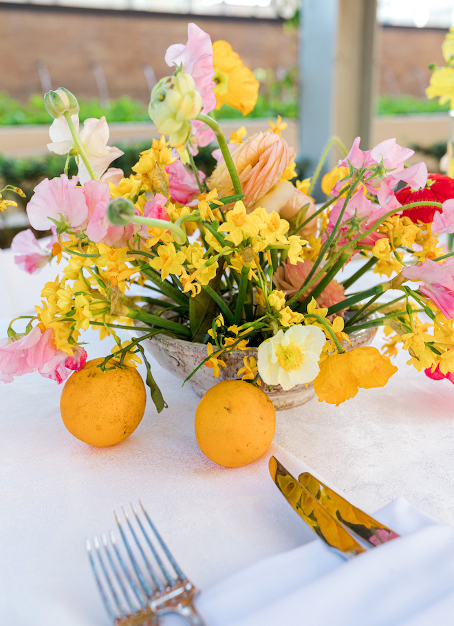Arrangement of bright florals as a table centerpiece.
