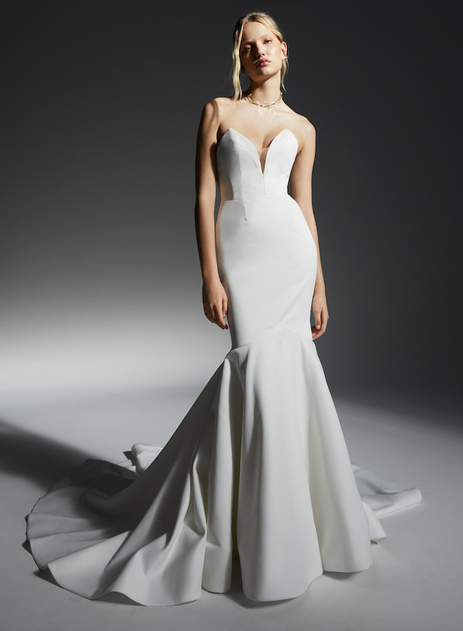 A model wearing a strapless bridal gown from Rita Vinieris fall collection.