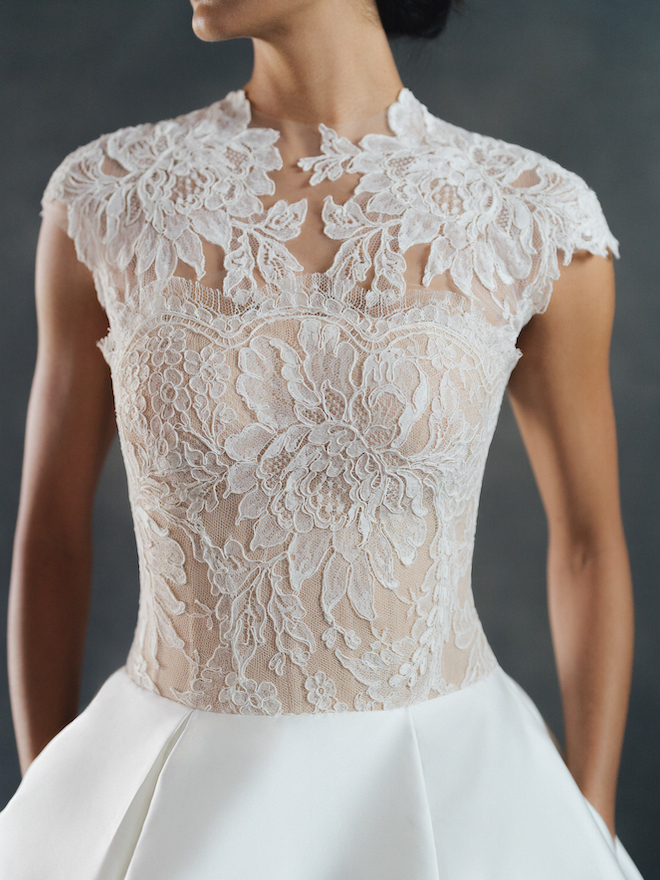 The Wessex gown by Anne Barge follows the removable elements trend with short lace sleeves that can be attached to the lace bodice.