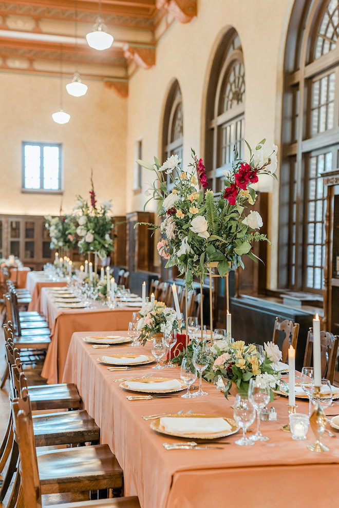 White, red and blush florals lining the reception tables.