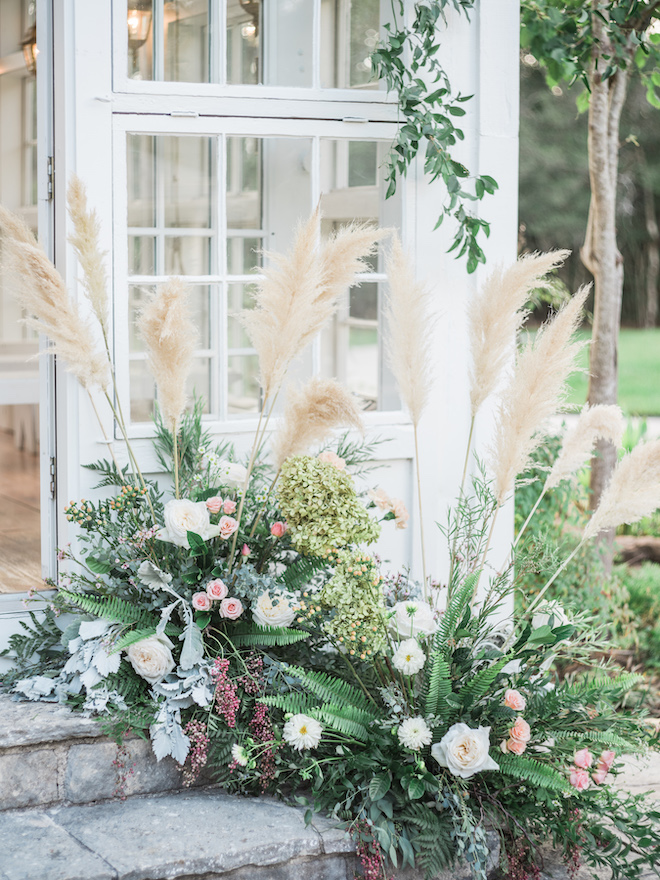 The floral arrangement leading up to the chapel for the secret garden editorial.