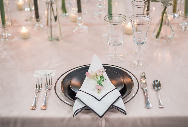 Slate gray plates and table arrangement at the reception.