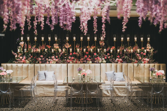 Purple blooms adorn the reception at this glamorous Houston wedding in the museum district.