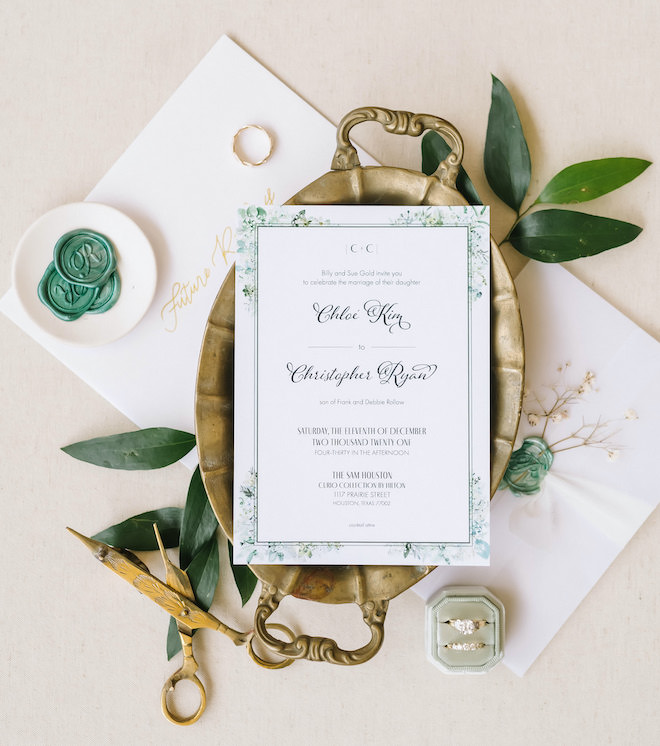 White and forest green wedding invitations.