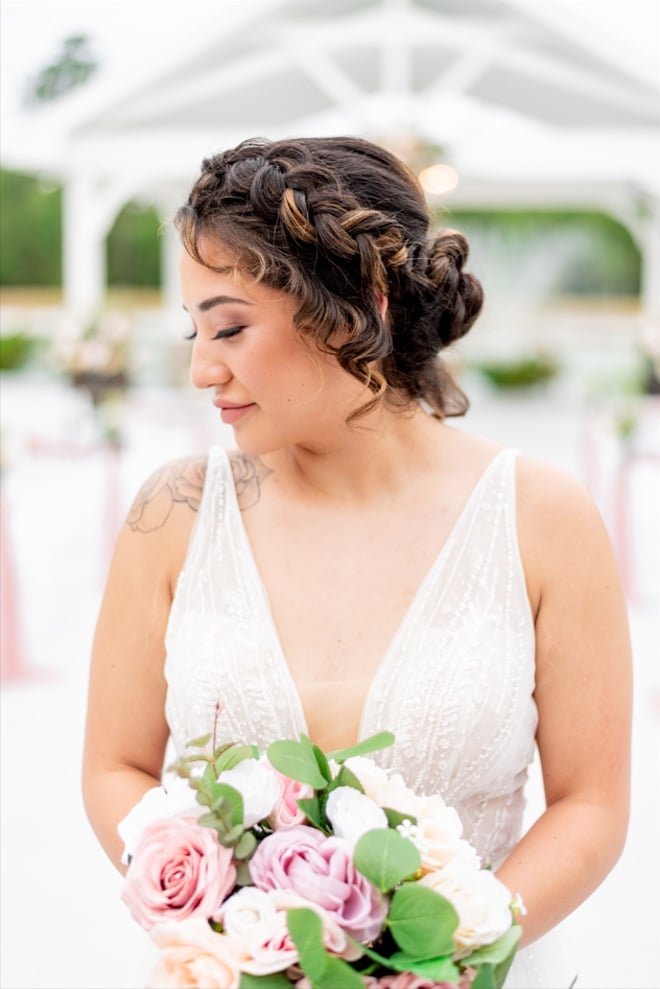 A bride with a braided updo by makeup artist Polished Makeup and Hair in Houston, Texas