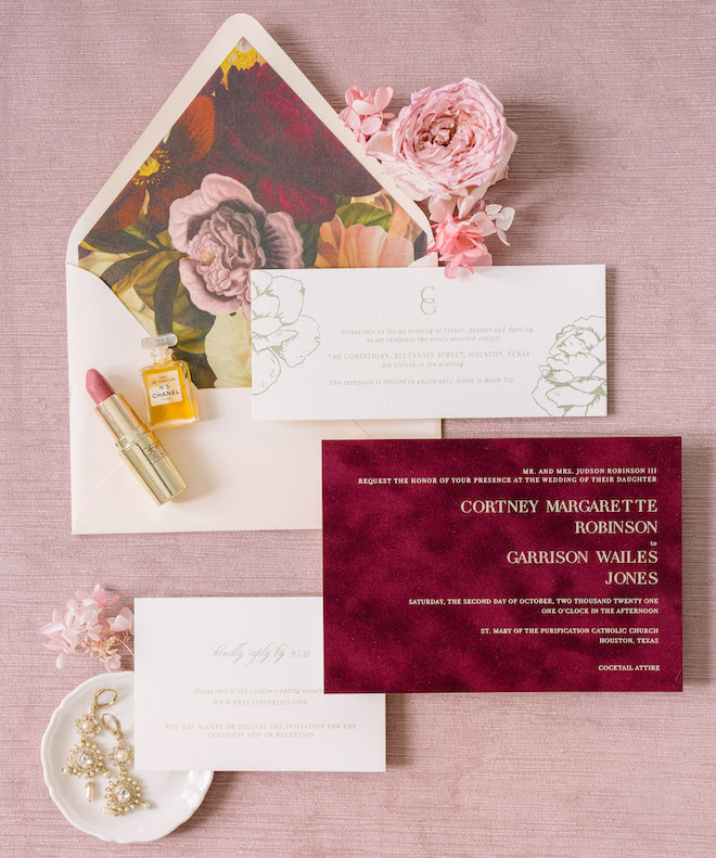 The invitation suite with burgundy and blush tones.