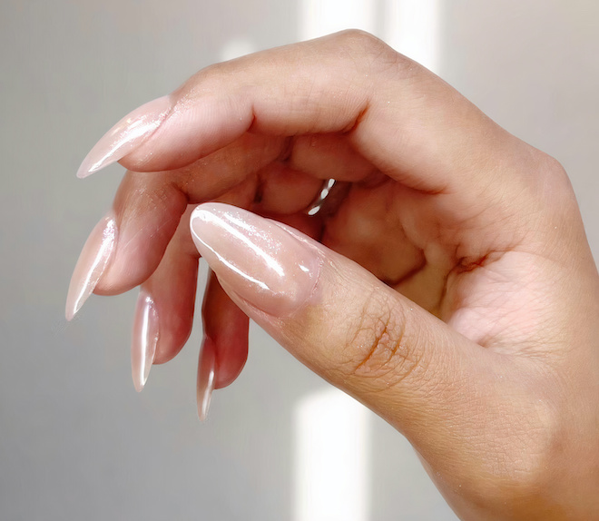 Nude chrome nails on a hand