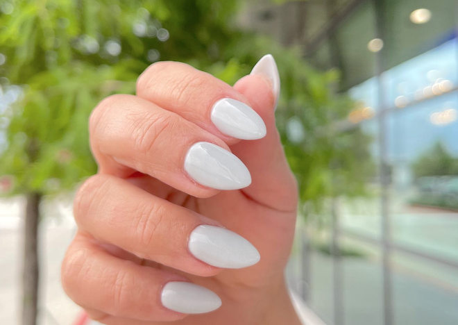 White Manicure set on a female hand