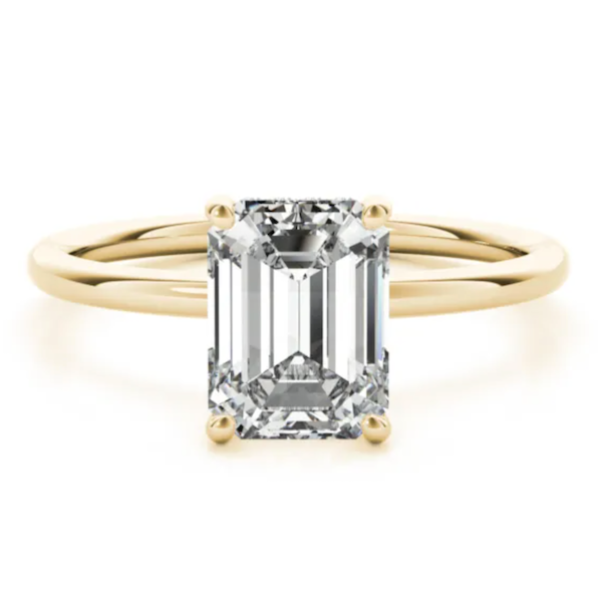 Emerald cut diamond with a gold band