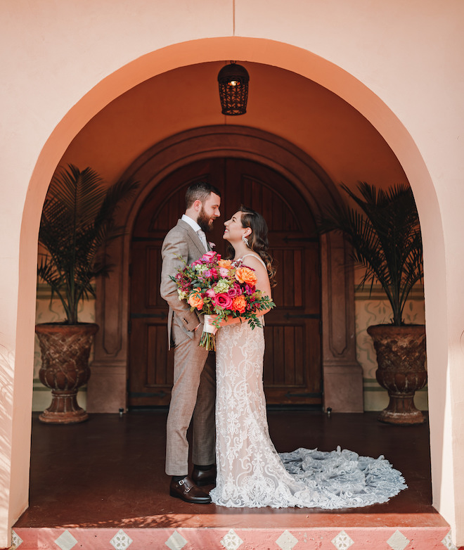 A bride and groom smiling at each other on their wedding day at Madera Estates.