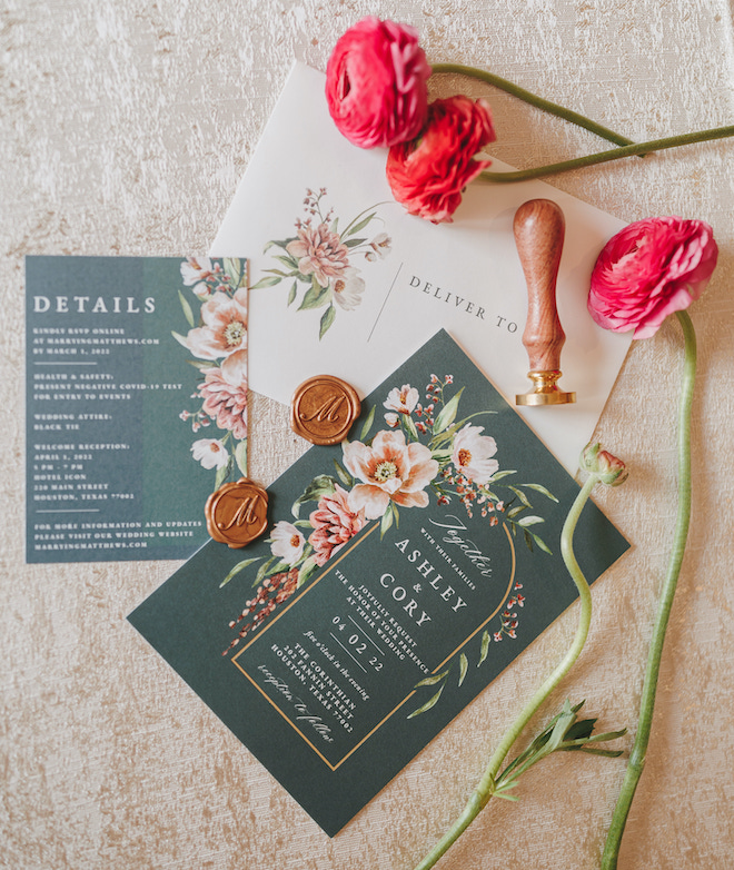 An invitation suite, fresh peonies and wax seals. 