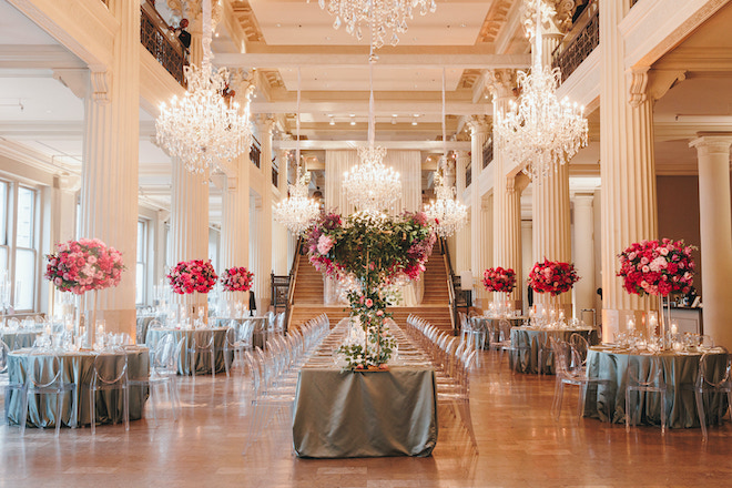 Grand floral arrangements, reception tables and chandeliers for a wedding at the Corinthian Houston.