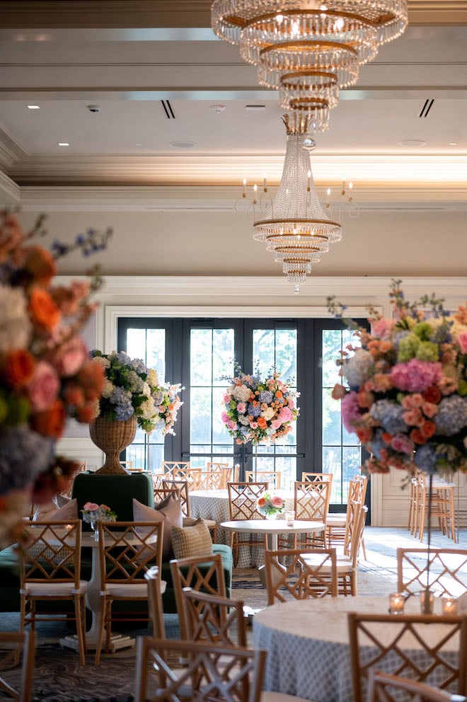 Bright colored florals decorating the reception for an elegant spring wedding.