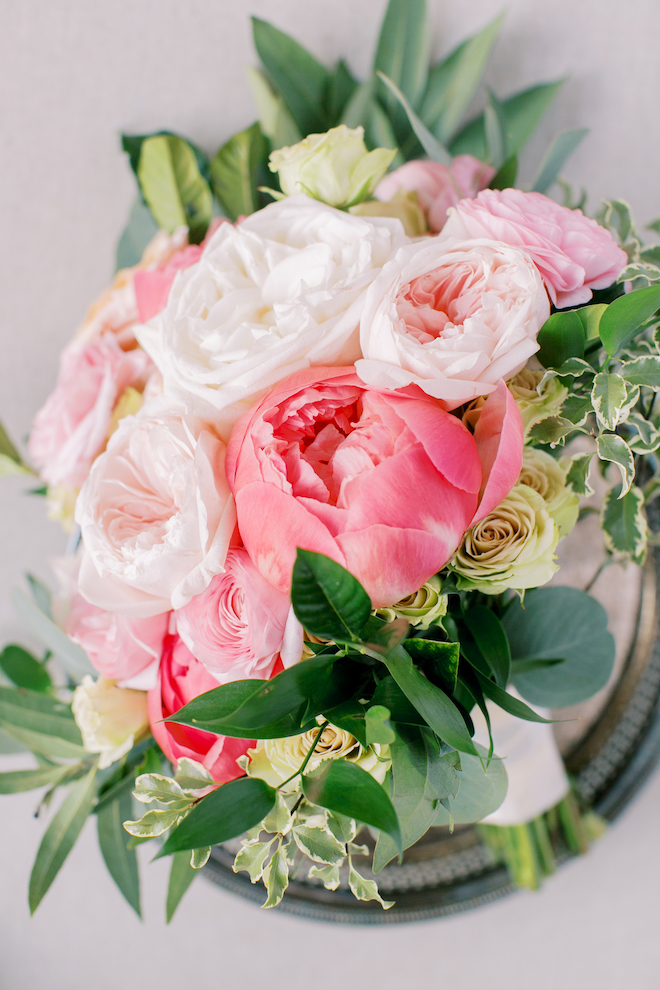 A bouquet with pink, blush and white flowers.