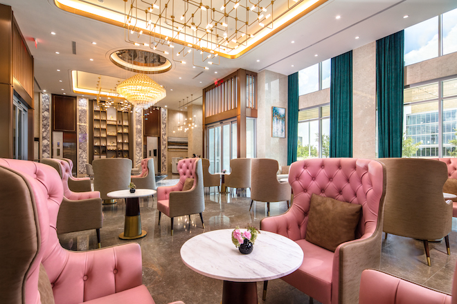 The Blossom Hotel decorated with pink chairs. 