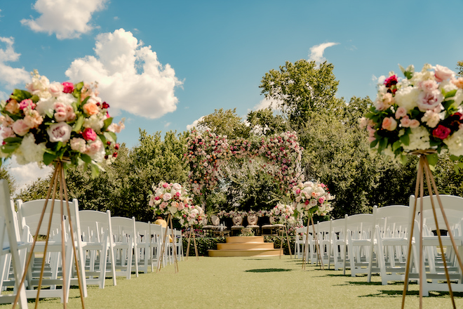 The floral-filled Mandap and ceremony space for a wedding at Hyatt Lost Pines Resort and Spa.