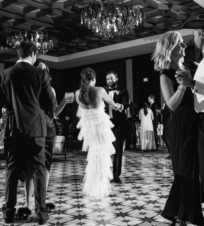 The bride and groom dancing on the custom dance floor.
