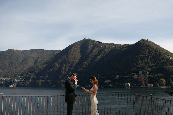 The groom wiping a tear as the bride reads her vows at their intimate elopement in Lake Como.