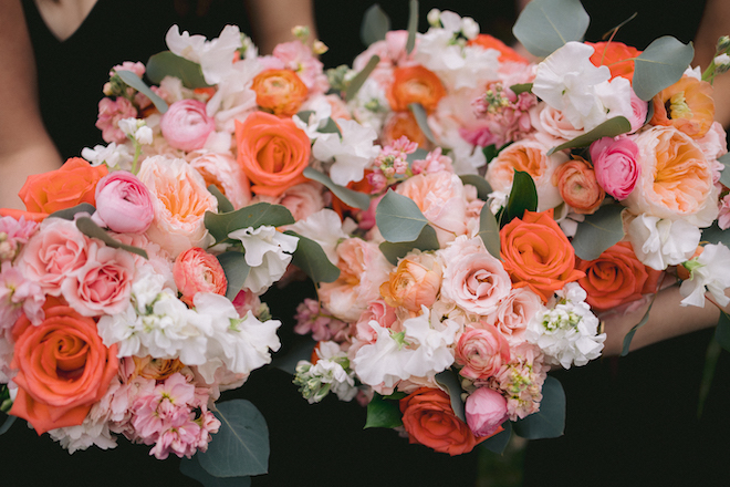 Bouquets with white, orange peach and pink florals. 