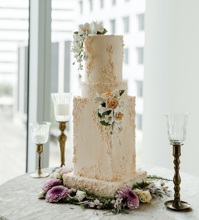 A pink wedding cake inspired by the Houston skyline.