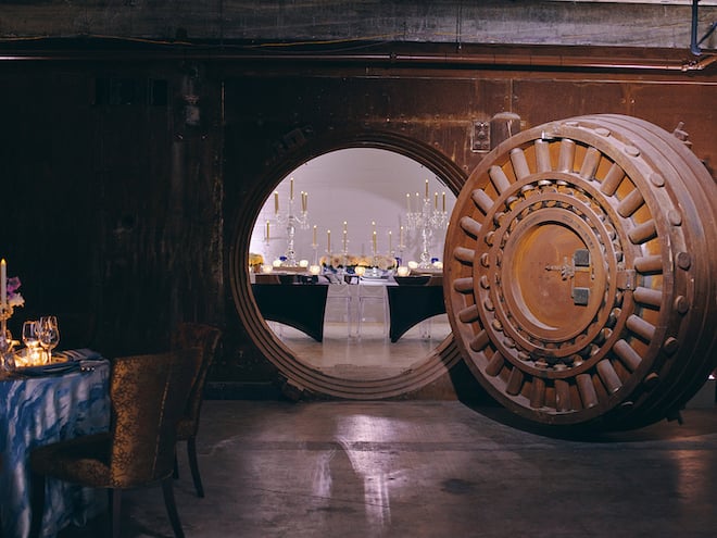 A decorated dining table inside The Vault at Corinthian Houston, a perfect spot for rehearsal dinners.
